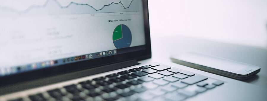 Laptop with graph tracking business strategy