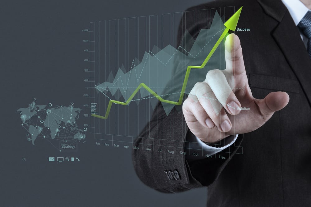 businessman hand draws business success chart concept on virtual screen