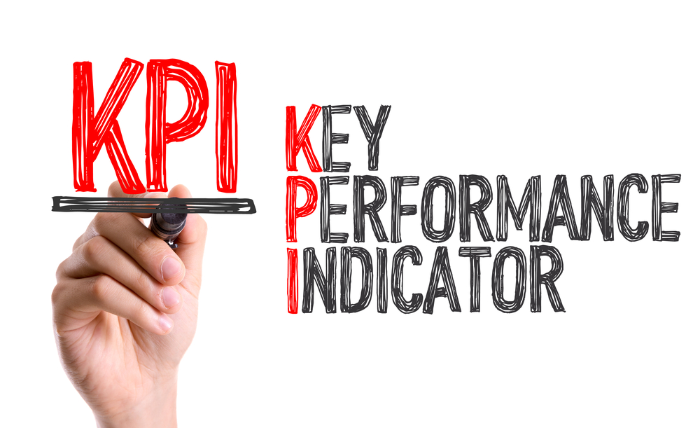 Hand with marker writing: KPI