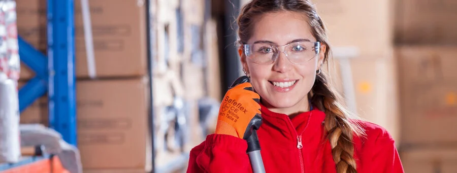 Lady wearing a red shirt and protective eyewear 